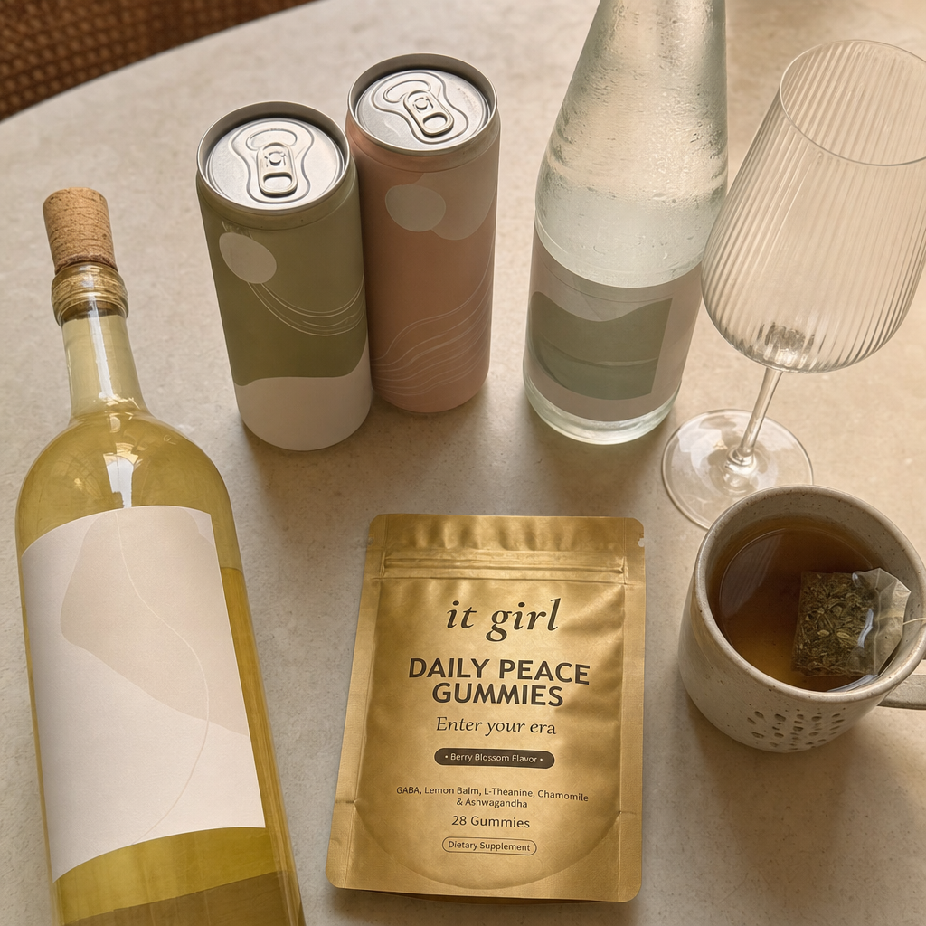 Warm overhead flat-lay of the abandoned alternatives a woman tried instead of wine, a corked alcohol-free wine bottle, two adaptogen mocktail cans, sparkling water and a cold mug of tea all unused, with the real It Girl Daily Peace pouch set apart as the one that actually delivers the signal