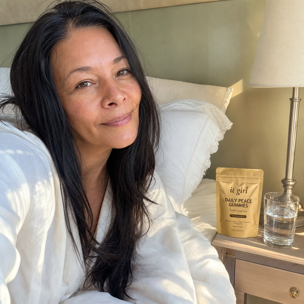 A woman waking clear and rested in soft morning light with the gold Daily Peace pouch on her nightstand, no foggy wine morning