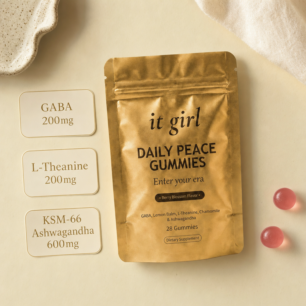 A dose card reading GABA 200mg, L-Theanine 200mg and KSM-66 Ashwagandha 600mg beside the real It Girl Daily Peace pouch and gummies.