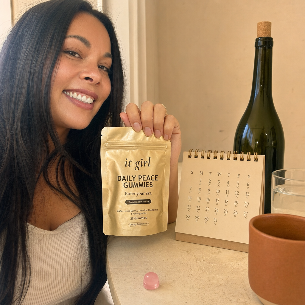 The palm-sized Daily Peace pouch beside a month calendar and a single bottle of wine, a whole month of calm for less than one bottle