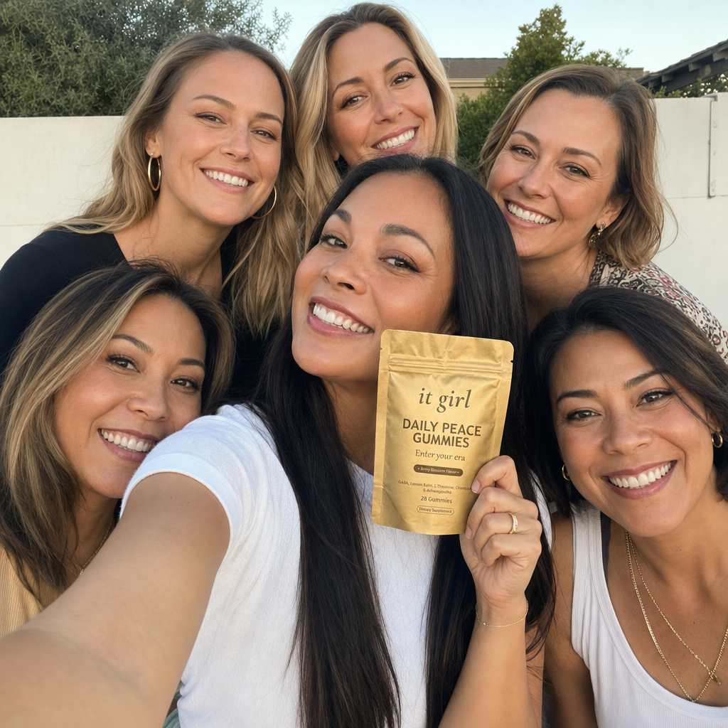 A warm group selfie of several diverse real women, one holding up the It Girl Daily Peace pouch, the 9,000-plus women who made it their evening ritual