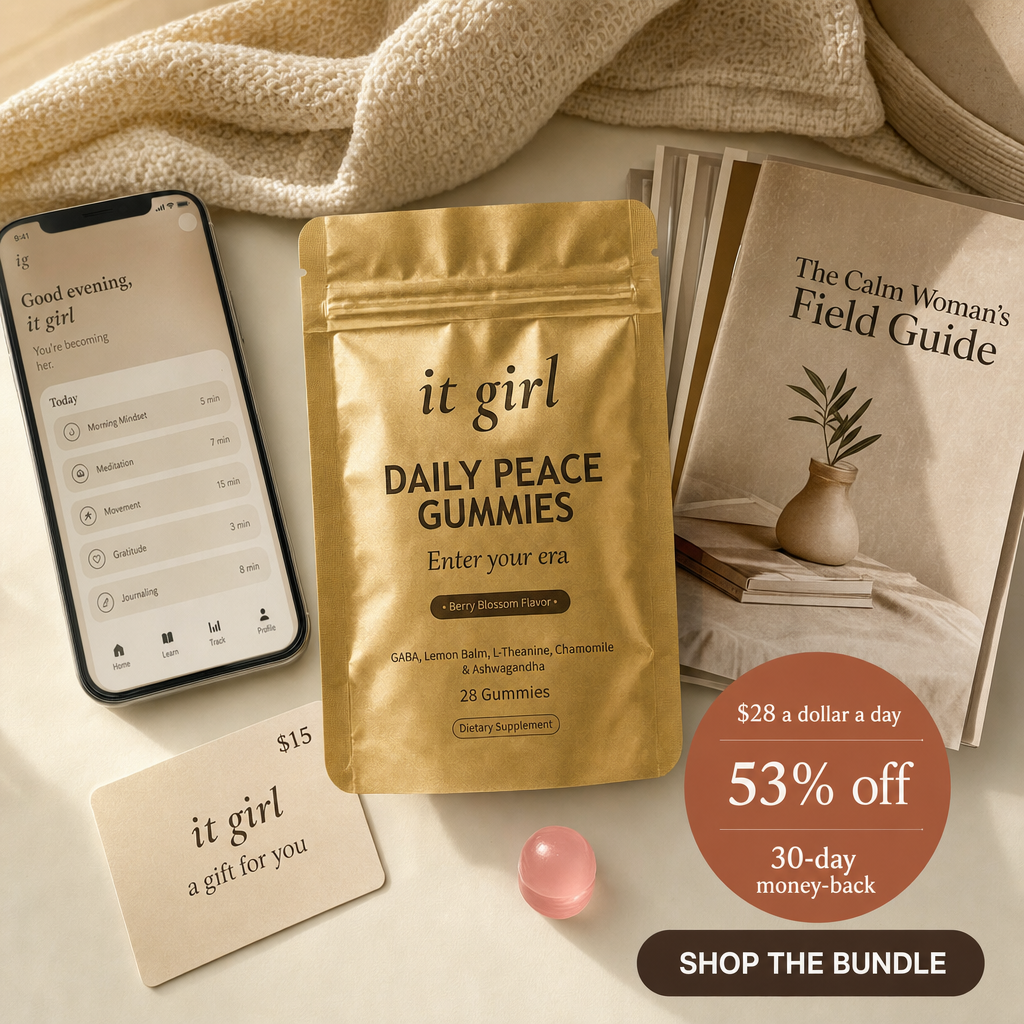 Daily Peace bundle on cream, the gold pouch, the It Girl app on a phone, a fifteen dollar gift card, the Calm Woman's Field Guide booklet and a warm-clay price and guarantee badge, no wine