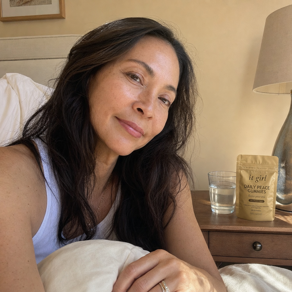 A woman waking clear and rested in soft morning light with the gold Daily Peace pouch on her nightstand, no foggy wine morning