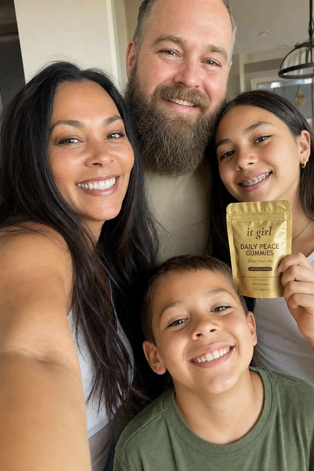 Ultra-realistic candid family selfie: a happy woman in her early 40s taking a phone selfie with her bearded husband, her 13-year-old daughter holding up the real matte-gold It Girl Daily Peace pouch, and her 6-year-old son, in warm home light