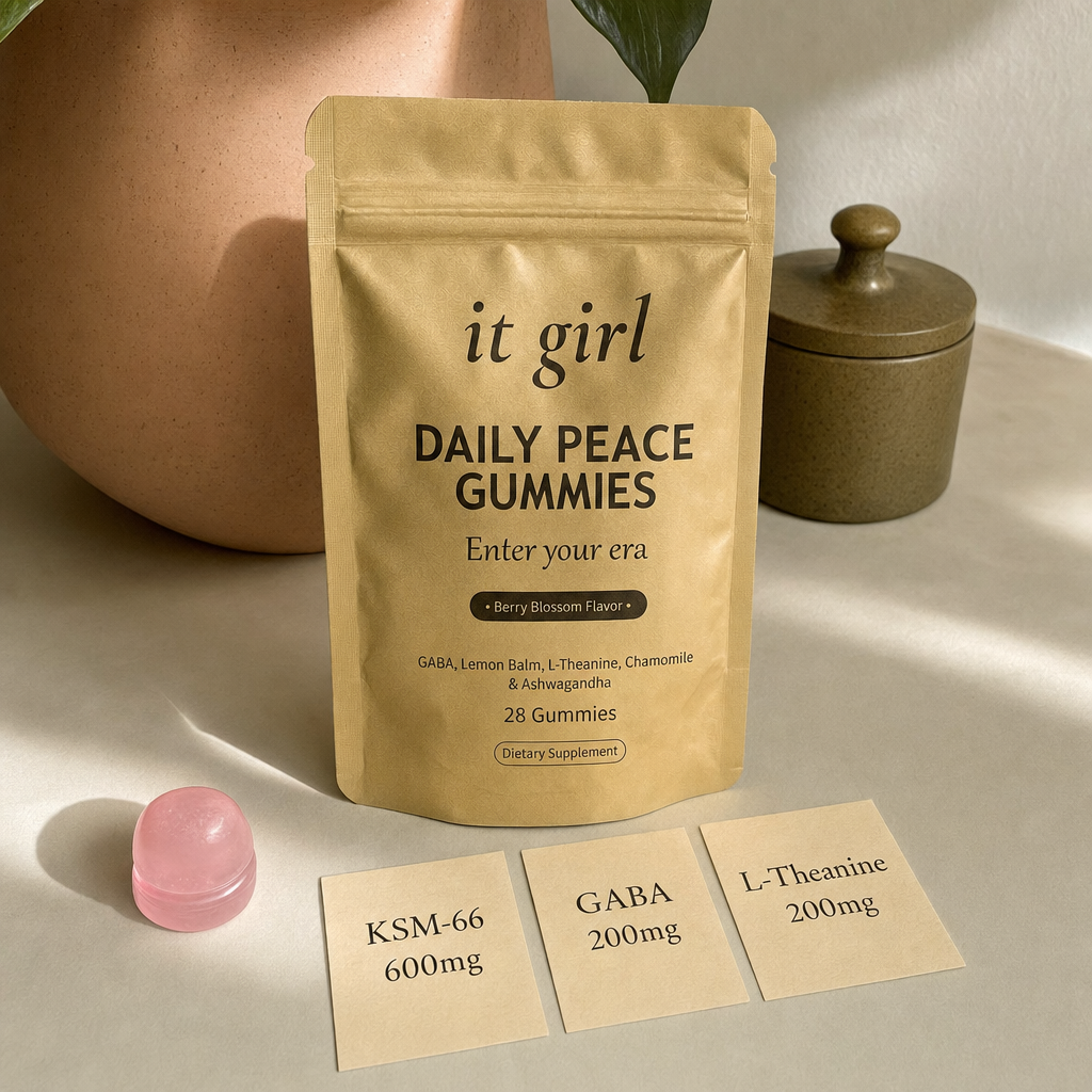 Three warm dose cards reading KSM-66 600mg, GABA 200mg, L-Theanine 200mg beside a single gummy and the gold pouch on cream, the studied dose