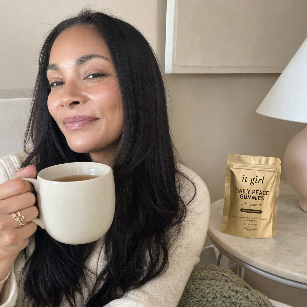 The same woman restored and calm in her early evening, at ease with a mug of tea, the gold Daily Peace pouch resting nearby, no wine glass in sight
