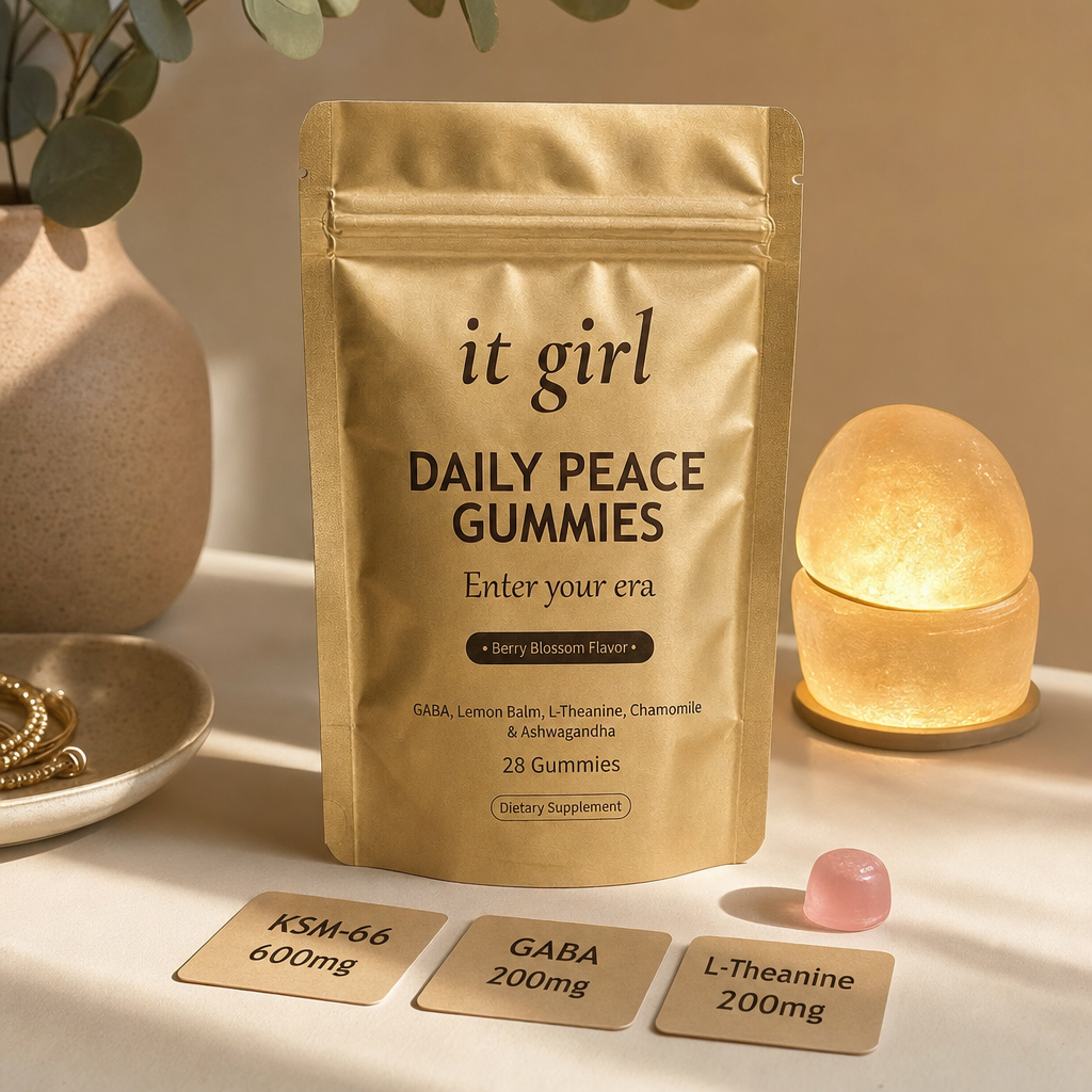The real matte-gold It Girl Daily Peace pouch with a single pink gummy and three dose cards reading KSM-66 600mg, GABA 200mg, L-Theanine 200mg, beside the receptor-of-light switch glowing a steady clean gold, the molecule that reaches the same receptor without the 3am cost