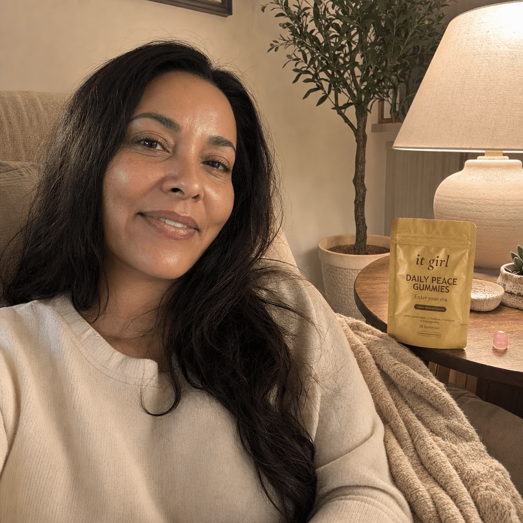 Mom about forty on the couch in the evening, calm and present with her kids' things nearby, the Daily Peace pouch on the side table, no wine, it was never willpower