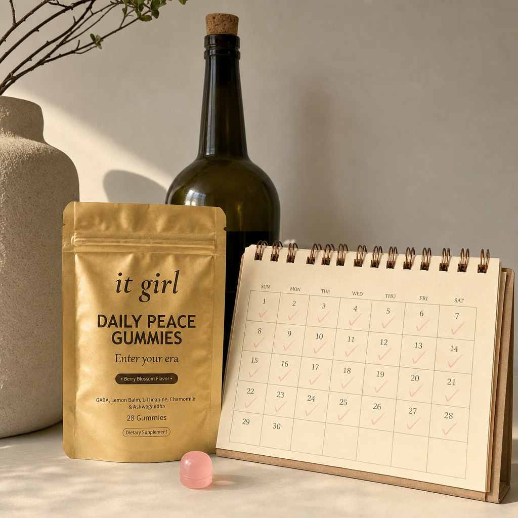 The palm-sized It Girl Daily Peace pouch beside a month calendar and one plain unbranded bottle of wine, a whole month of calm shown to cost less than a single bottle