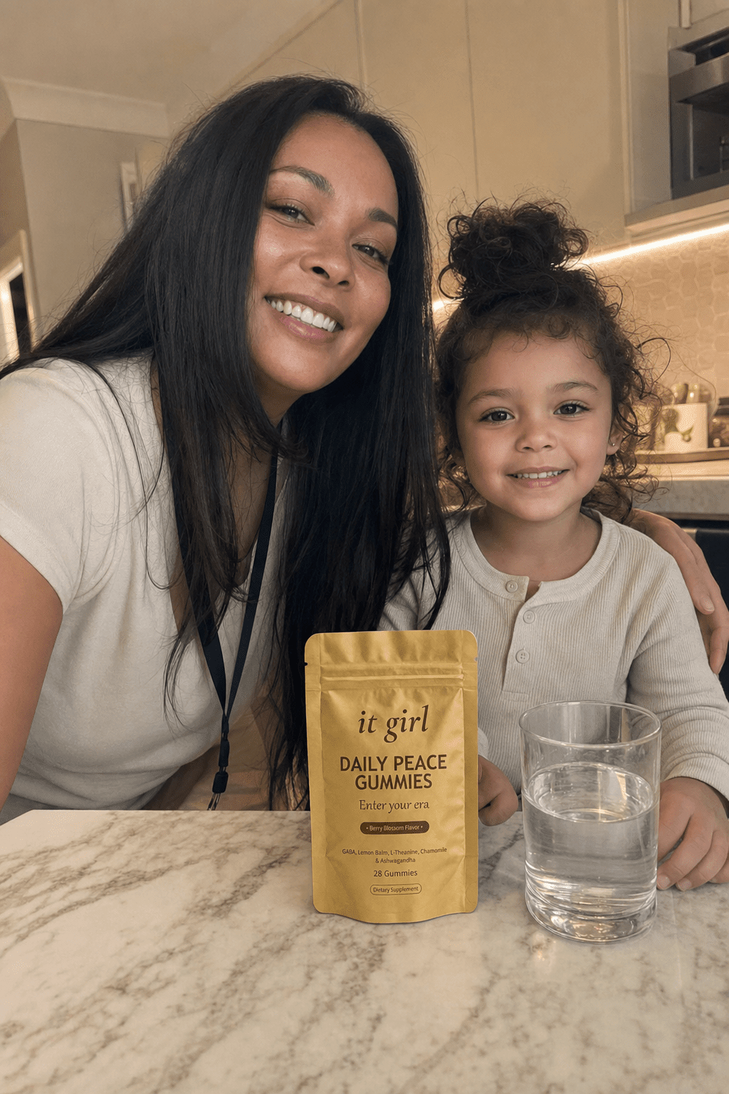 Ultra-realistic candid photo: the same woman about 40 just home from work, lanyard still on and blazer over a chair, now relaxed and steady, crouched with her calm happy child, the real matte-gold It Girl Daily Peace pouch on the counter in warm evening light