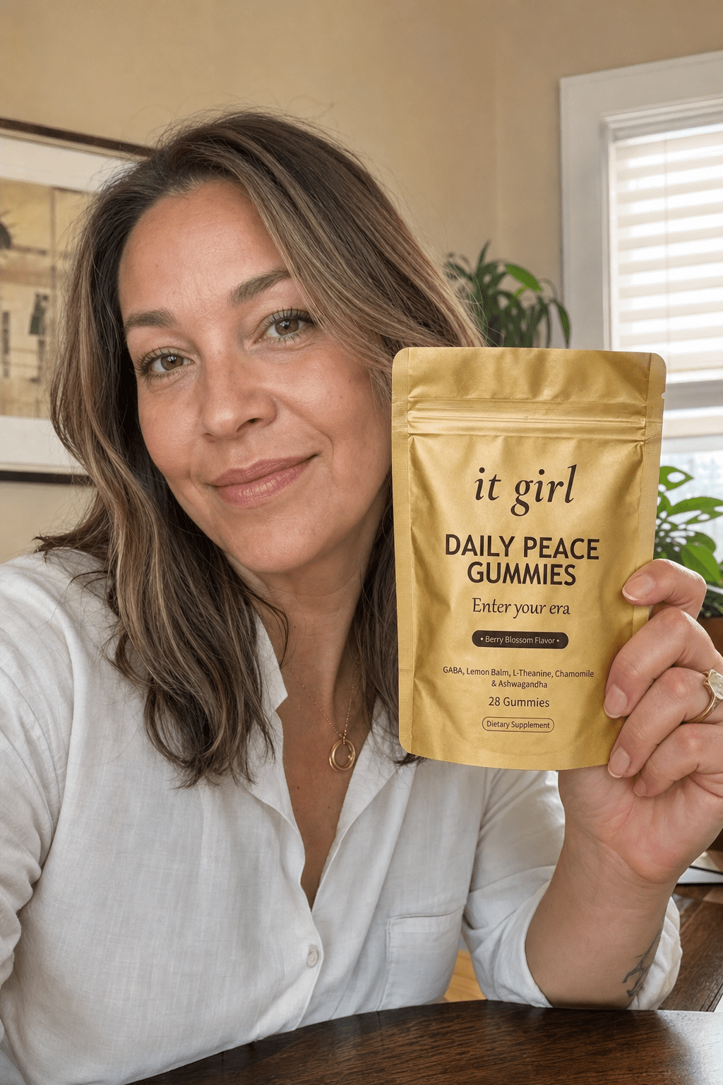 Maya Ellison, a warm licensed therapist in her early thirties, sitting in a calm cream-toned office looking at the camera with a genuine open expression