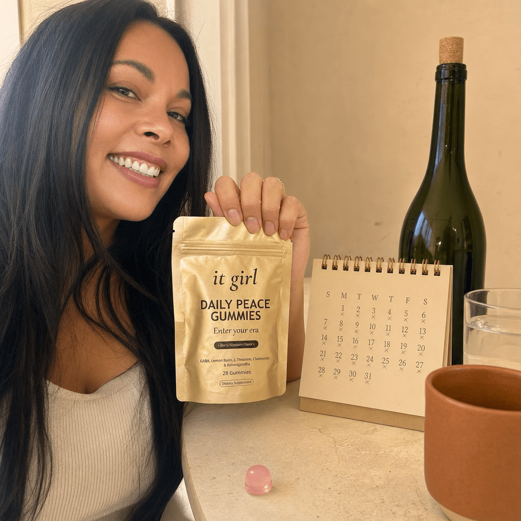 The palm-sized Daily Peace pouch beside a month calendar and a single bottle of wine, a whole month of calm for less than one bottle