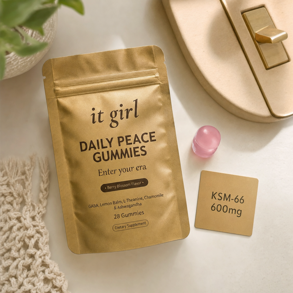 Single pink Daily Peace gummy beside the gold pouch and a warm-toned dose card reading KSM-66 600mg, the cortisol layer underneath