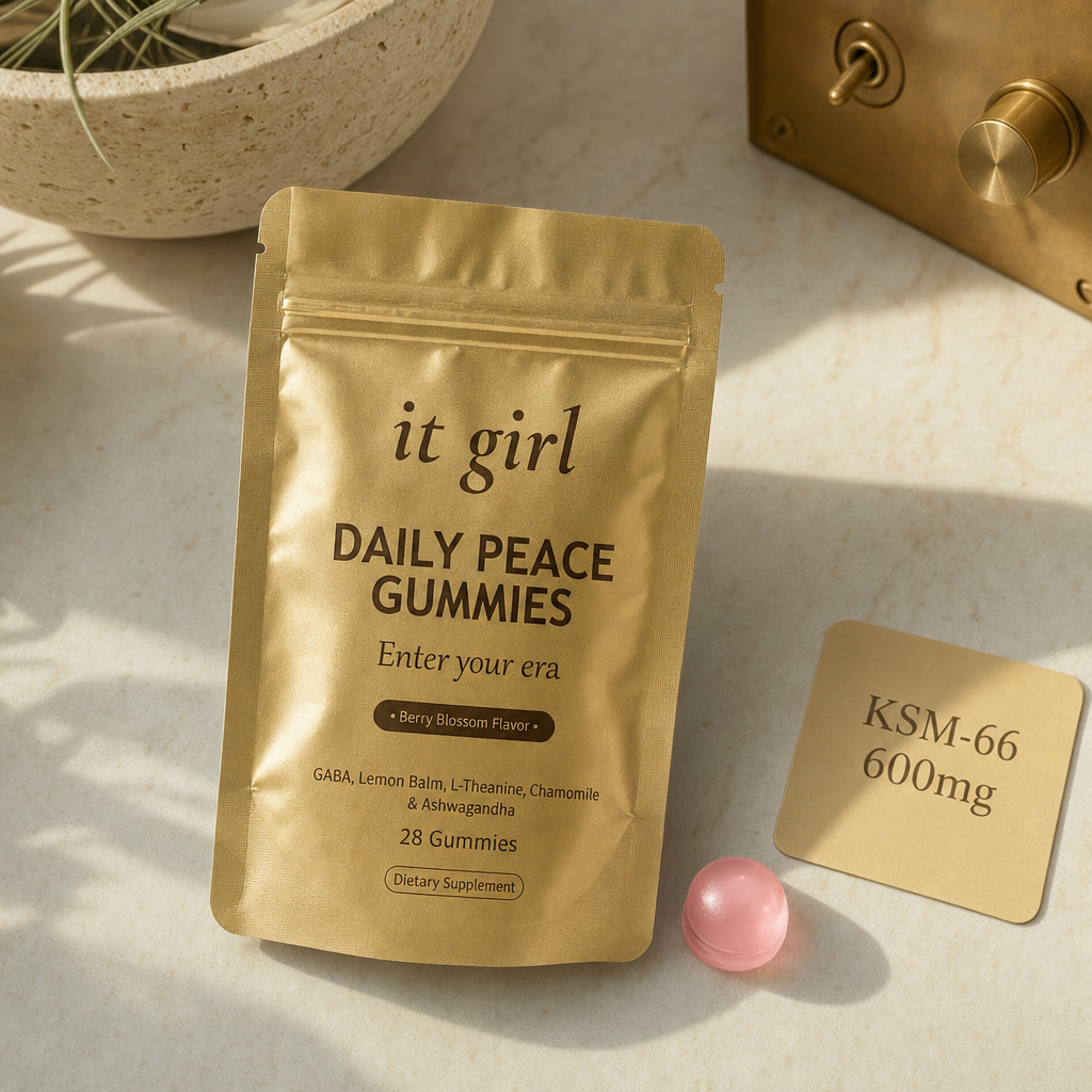 Single pink Daily Peace gummy beside the gold pouch and a warm-toned dose card reading KSM-66 600mg, the cortisol layer underneath