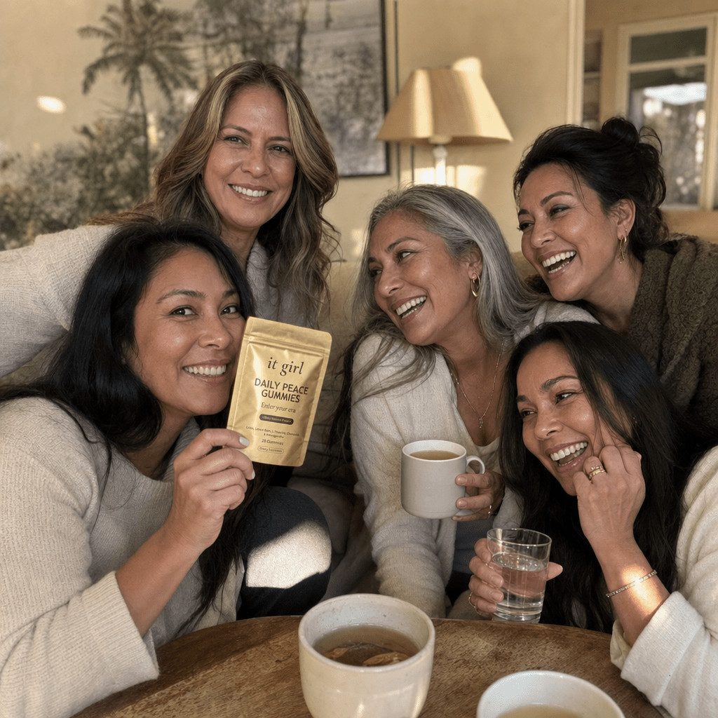 Warm candid group of women in their forties and fifties laughing together in a sunlit room, the gold Daily Peace pouch held in frame, third-party tested and made for women