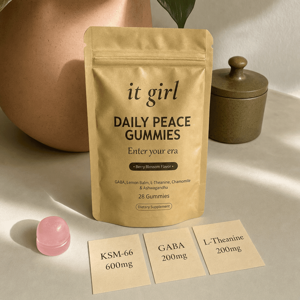 Three warm dose cards reading KSM-66 600mg, GABA 200mg, L-Theanine 200mg beside a single gummy and the gold pouch on cream, the studied dose